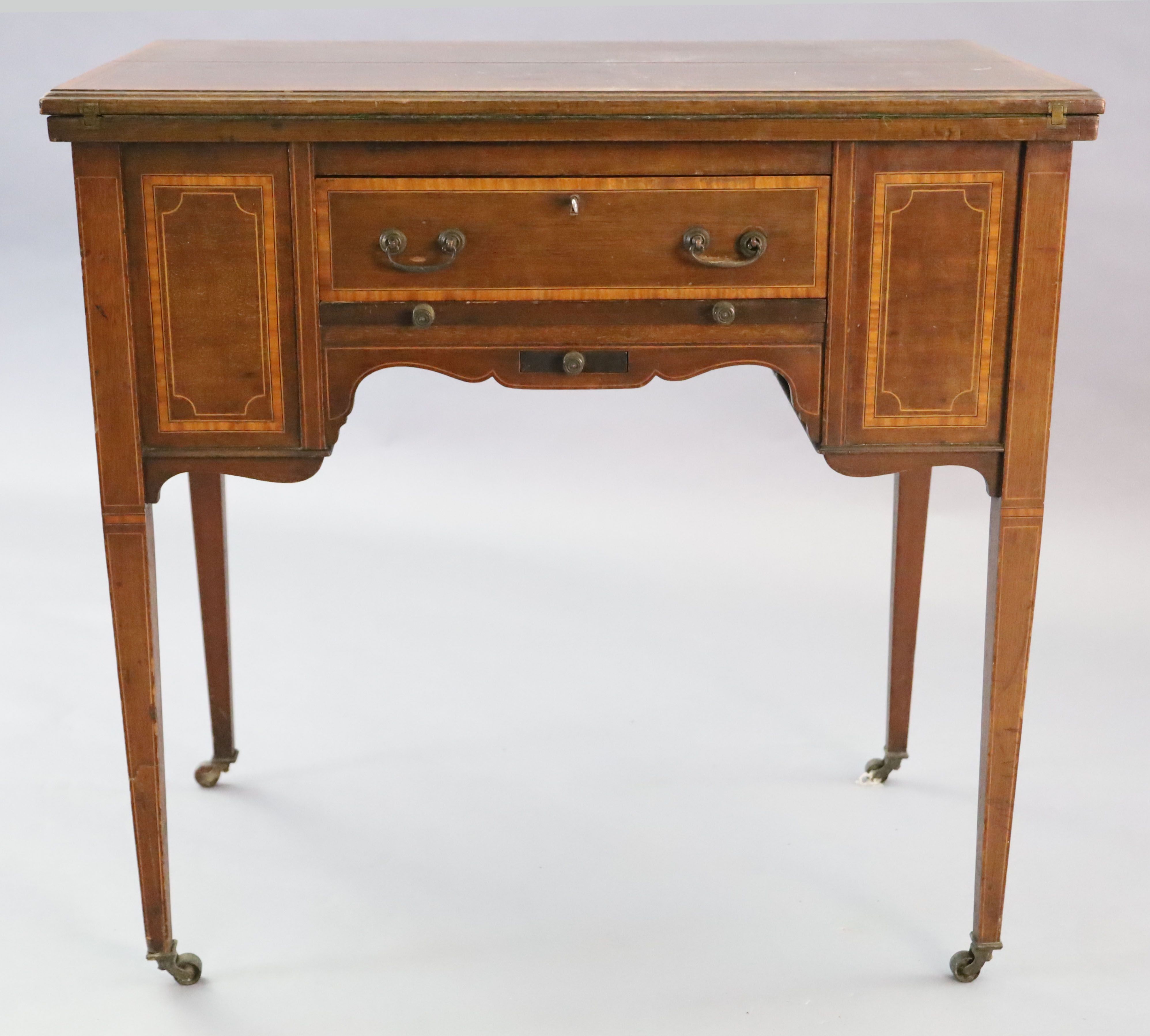 An Edwardian satinwood banded mahogany games/drinks table,